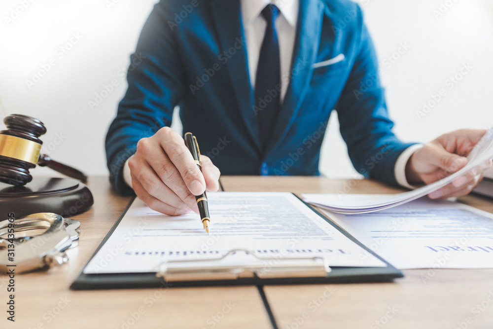 The private office workplace for consultant an young lawyer legislation with gavel and document on wood table. The private office workplace for consultant an young lawyer legislation with gavel and document on wood table.
