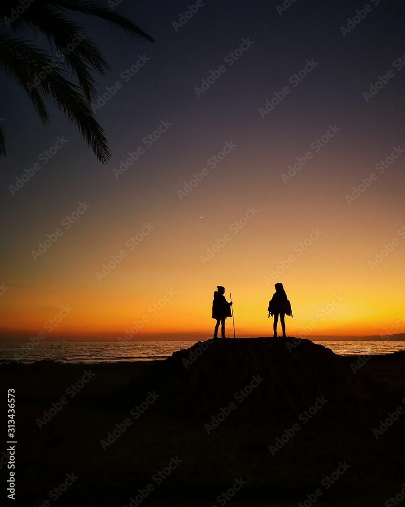 silhouette of couple at sunset