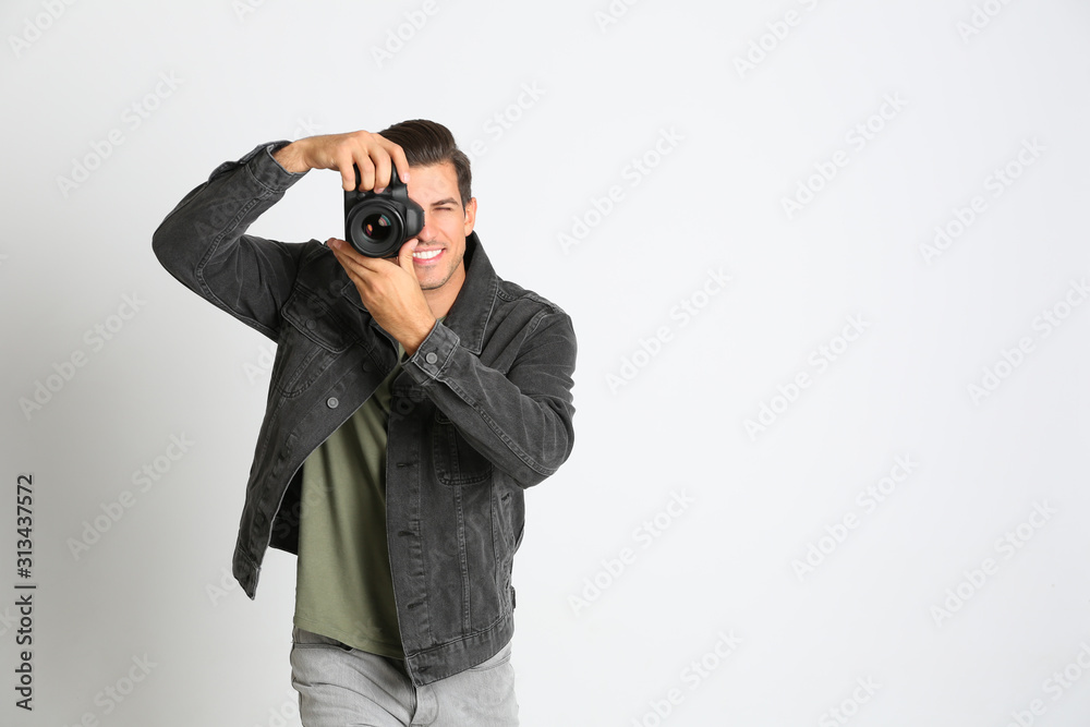 Professional photographer working on white background in studio Professional photographer working on white background in studio