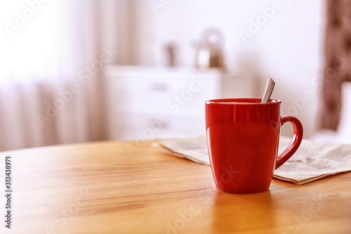 Morning coffee on wooden table indoors. Space for text