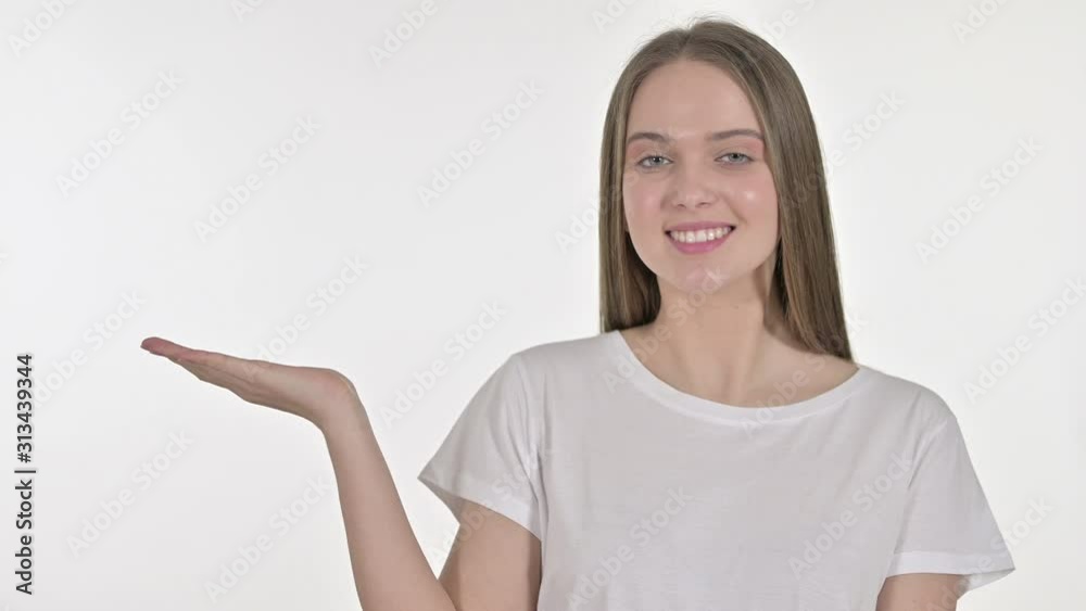 Young Woman Showing Product on Hand, White Background Young Woman Showing Product on Hand, White Background