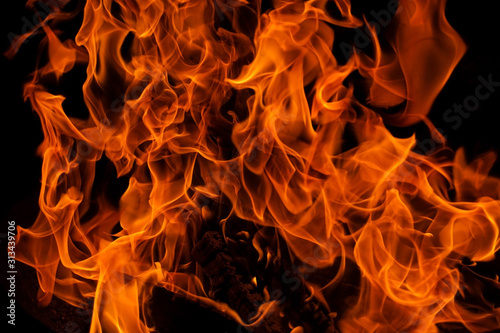 Large burning flames with black background