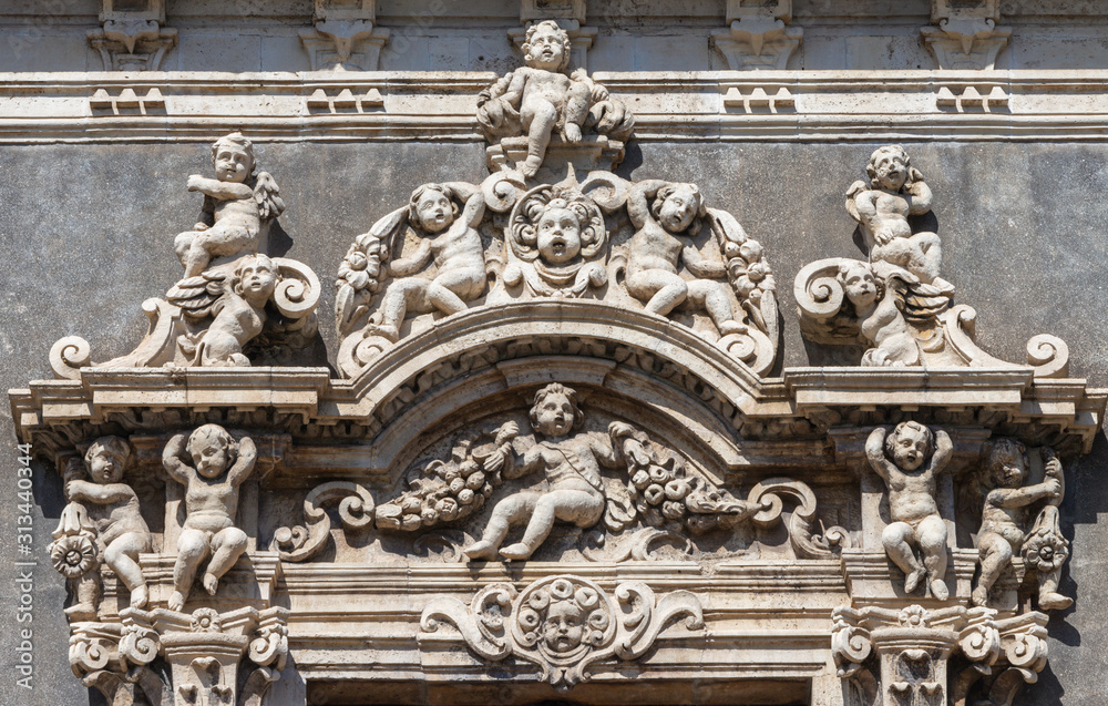 CATANIA, ITALY - APRIL 8, 2018: The detail of top part of window from Palazzo Biscari.