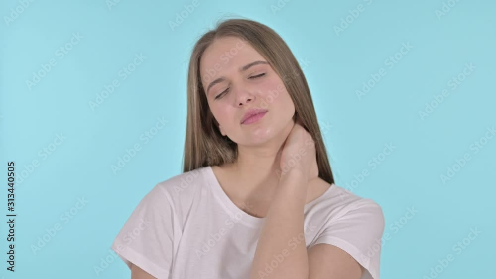 Tired Beautiful Young Woman having Neck Pain, Blue Background Tired Beautiful Young Woman having Neck Pain, Blue Background