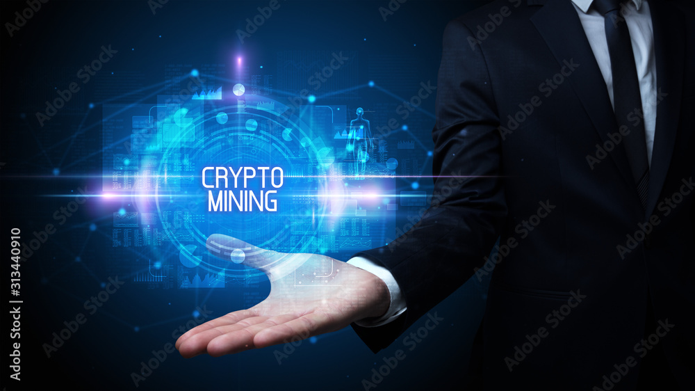 Man hand holding CRYPTO MINING inscription, technology concept Man hand holding CRYPTO MINING inscription, technology concept