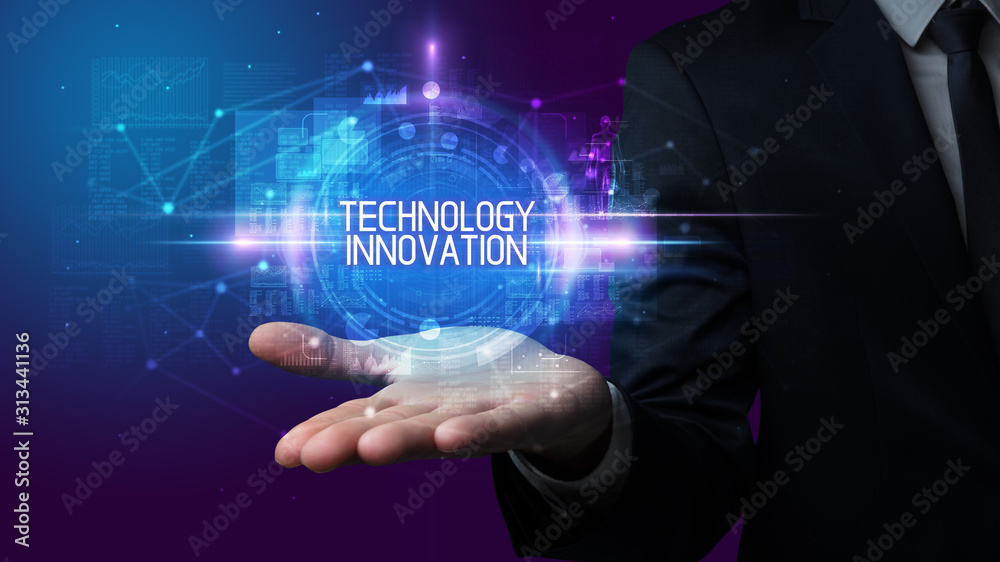 Man hand holding TECHNOLOGY INNOVATION inscription, technology concept Man hand holding TECHNOLOGY INNOVATION inscription, technology concept