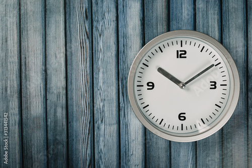 Wallpaper Mural White wall clock with a yellow used hanging on the wall. Minimalist image of a wall clock on a wooden background with copy space Torontodigital.ca