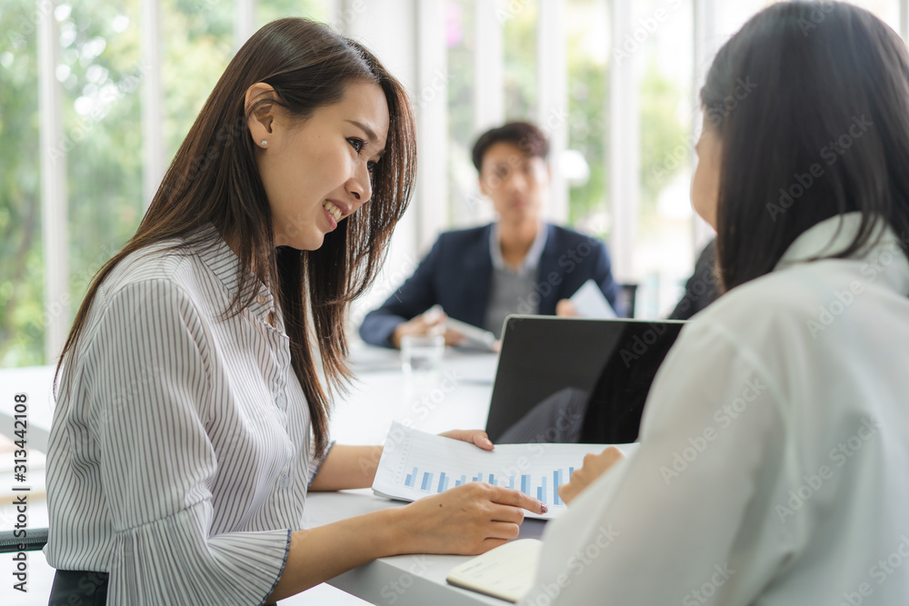 Business Woman teaching trainee employee in the office Business Woman teaching trainee employee in the office