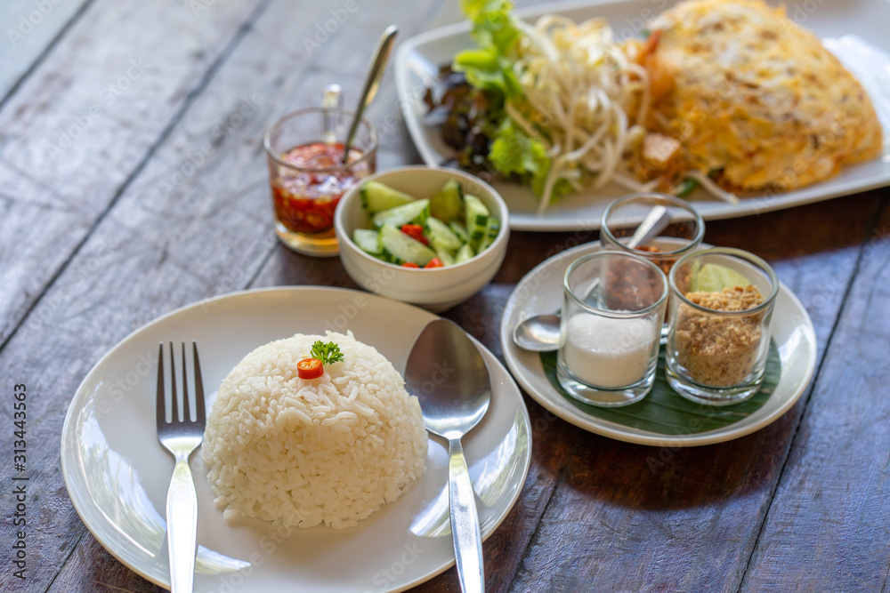 Fototapeta premium set fried noodle with egg on wooden table.
