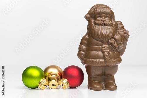 santa claus milk chocolate candy with baubles