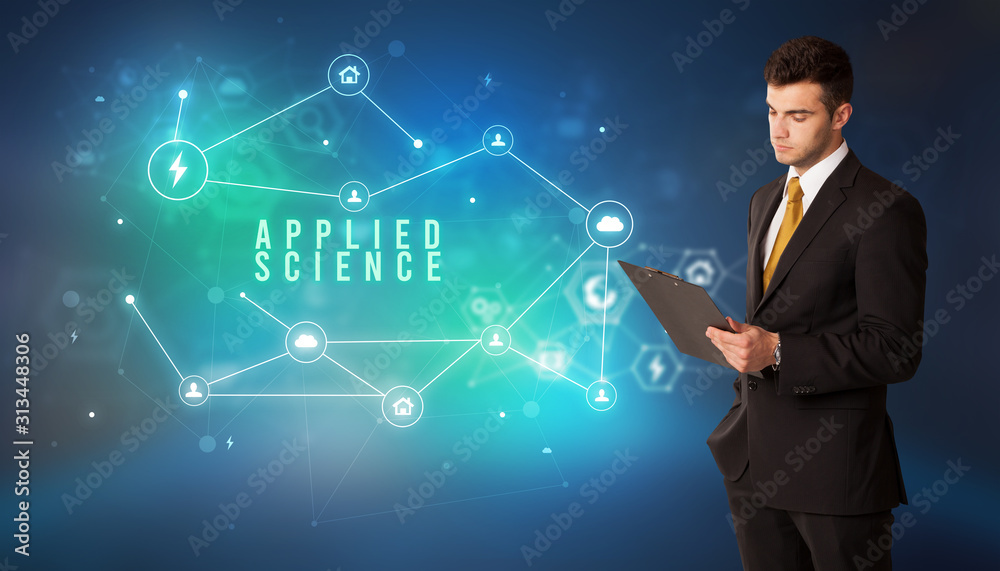 Businessman in front of cloud service icons with APPLIED SCIENCE inscription, modern technology concept Businessman in front of cloud service icons with APPLIED SCIENCE inscription, modern technology concept