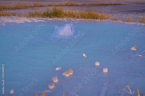 Old Crater in Manziana - carbon dioxide coming out of the earth through water and forming small geyser photo