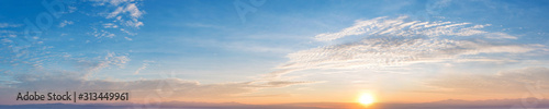 Panorama of Dramatic vibrant color with beautiful cloud of sunrise and sunset. Panoramic image. © tanarch