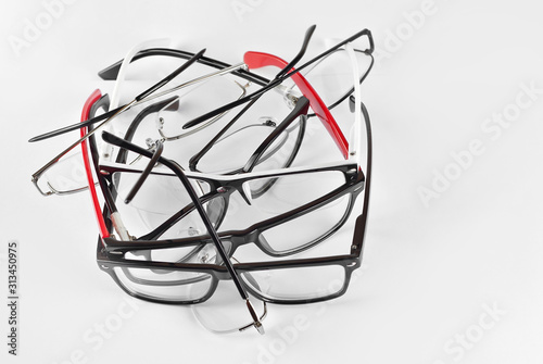 Glasses on a white background. Many glasses are dropped.