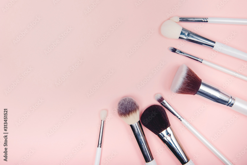 Set makeup brushes on pink color background. Top view point, flat lay - obrazy, fototapety, plakaty 