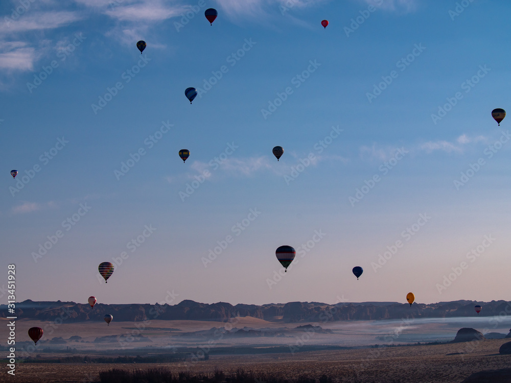 Winter at Tantora Hot Air Balloon Festival over Mada'in Saleh (Hegra) ancient site, Al Ula, Saudi Arabia Winter at Tantora Hot Air Balloon Festival over Mada'in Saleh (Hegra) ancient site, Al Ula, Saudi Arabia