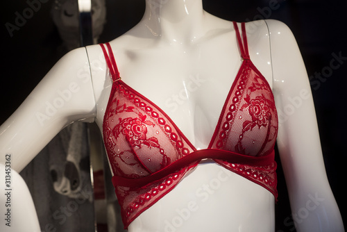 closeup of red bra on mannequin in fashion store showroom for women