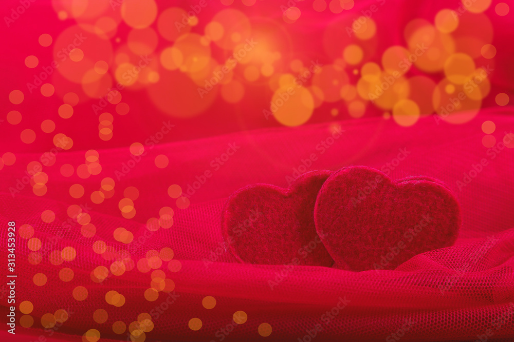 Greeting Card for Valentine's Day. Red hearts on red background bokeh. Copy space