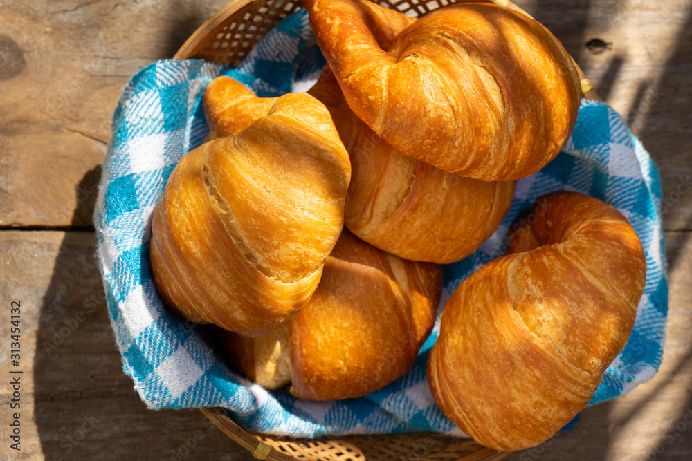 Butter croissant bread on wooden background