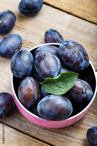 ripe plums on the table