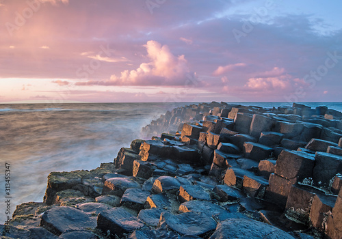 Sunset with the Giant's Causeway in the foreground photo