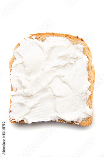 Slice of bread with sour cream spread on top