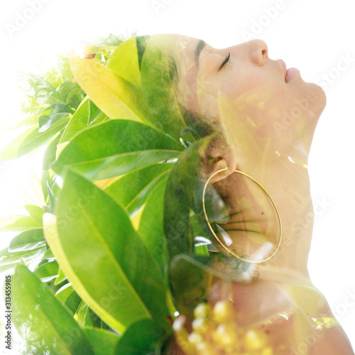 Double exposure portrait of a young woman