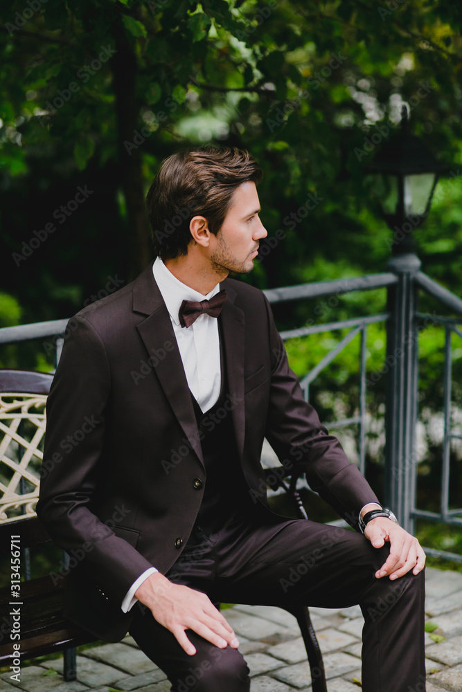 Close-up portrait of handsome young bridegroom with elegant stylish haircut Close-up portrait of handsome young bridegroom with elegant stylish haircut