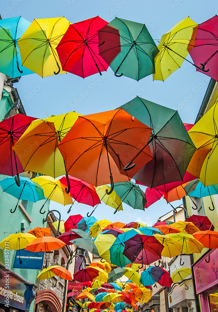Obraz premium Umbrellas hanging over the street