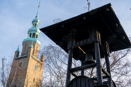Fototapeta Naklejka Na Ścianę i Meble -  Old wooden belfry of the miners from the silver mine at the church of Piotr and Paweł in Tarowskie Góry