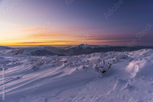 Mountain winter landscape in the Ukrainian Carpathians on the background of the sunset. © reme80