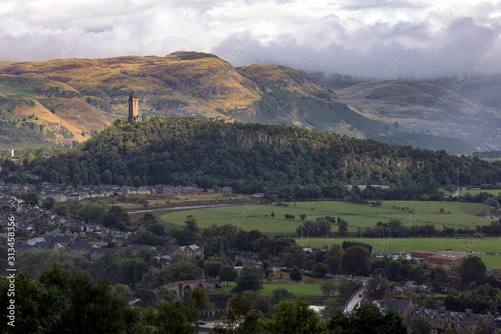 View of The National Wallace Monument and surroundings in Stirling, Scotland. The tower standing on the shoulder of the Abbey Craig, and commemorates Sir William Wallace, a 13th-century Scottish hero