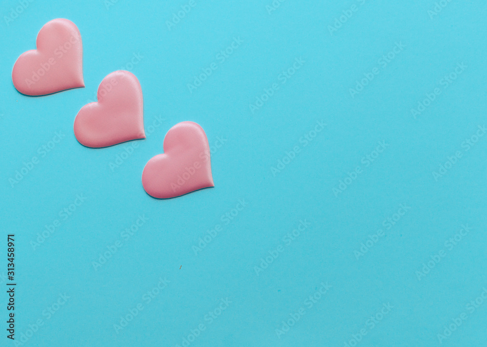 Valentine's Day background. A pink heart on blue background, flat lay minimal concept, trendy pop art style photo. Valentines day concept. Flat lay, top view, copy space Valentine's Day background. A pink heart on blue background, flat lay minimal concept, trendy pop art style photo. Valentines day concept. Flat lay, top view, copy space