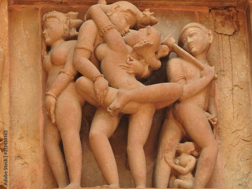 Erotic sculptures and sex poses of man in kajuraho temples, Madhya Pradesh, India. Built around 1050, it is a UNESCO world heritage site, a tourist destination. The concept of textures and postcards.