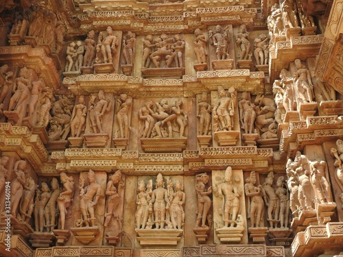 Erotic Human Sculptures at Vishvanatha Temple, Western temples of Khajuraho, Madhya Pradesh, India. Built around 1050, Khajuraho is UNESCO World heritage site and is tourist destination for erotica. photo