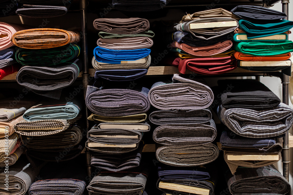 Rolls of fabric in stock. Interior of a industrial warehouse with fabric rolls. Rolls of fabric in stock. Interior of a industrial warehouse with fabric rolls.