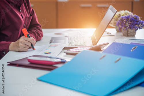 Business woman financial inspector and secretary making report, calculating or checking balance. internal revenue service inspector checking document. audit concept