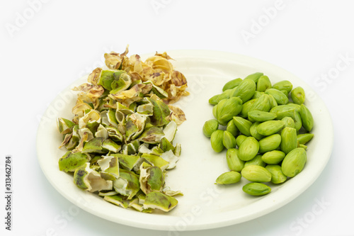 Stink bean on plate isolated on white background.