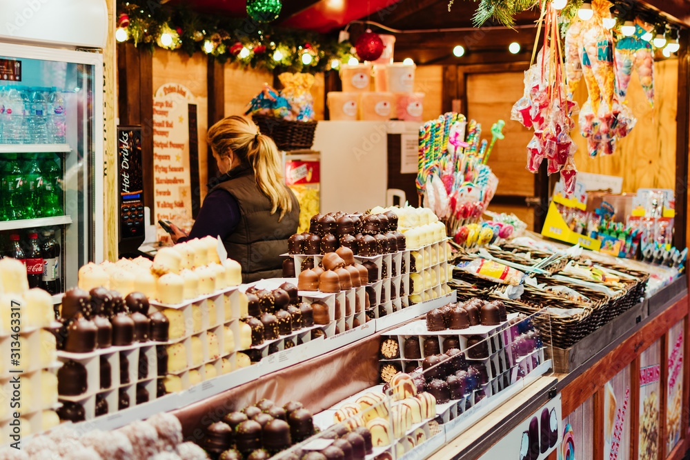 London, UK/Europe; 20/12/2019: Christmas stall with chocolates, candy and sweets at the Christmas market of Leicester Square, London