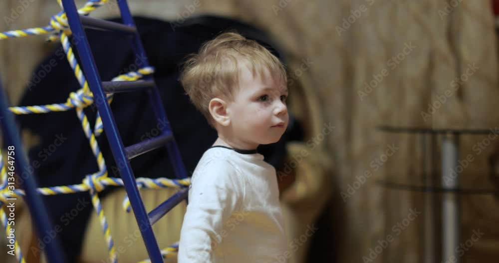 One year old boy on the gymnastic One year old boy on the gymnastic