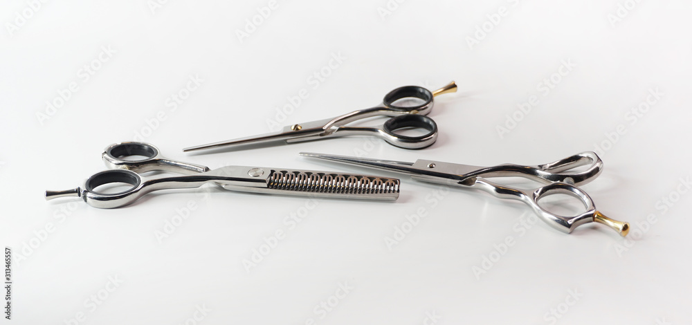 Hairdressing different scissors isolated on white background Hairdressing different scissors isolated on white background