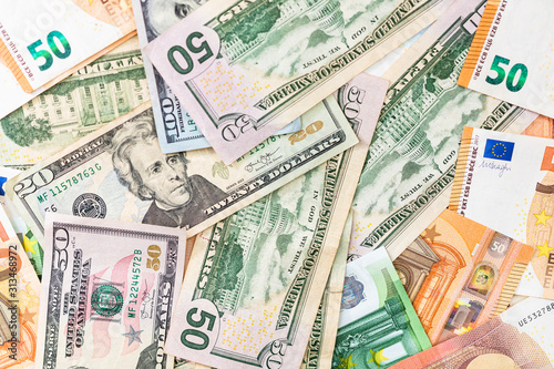 World money concept, detail on EURO and US dollar banknotes, EURO and US currency background, inflation, finance and business concept photo