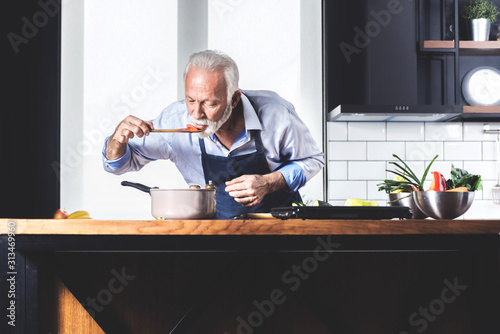 Senior single man in kitchen