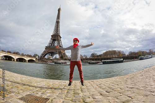 Man joyfully jumps high  in Paris © Santorines