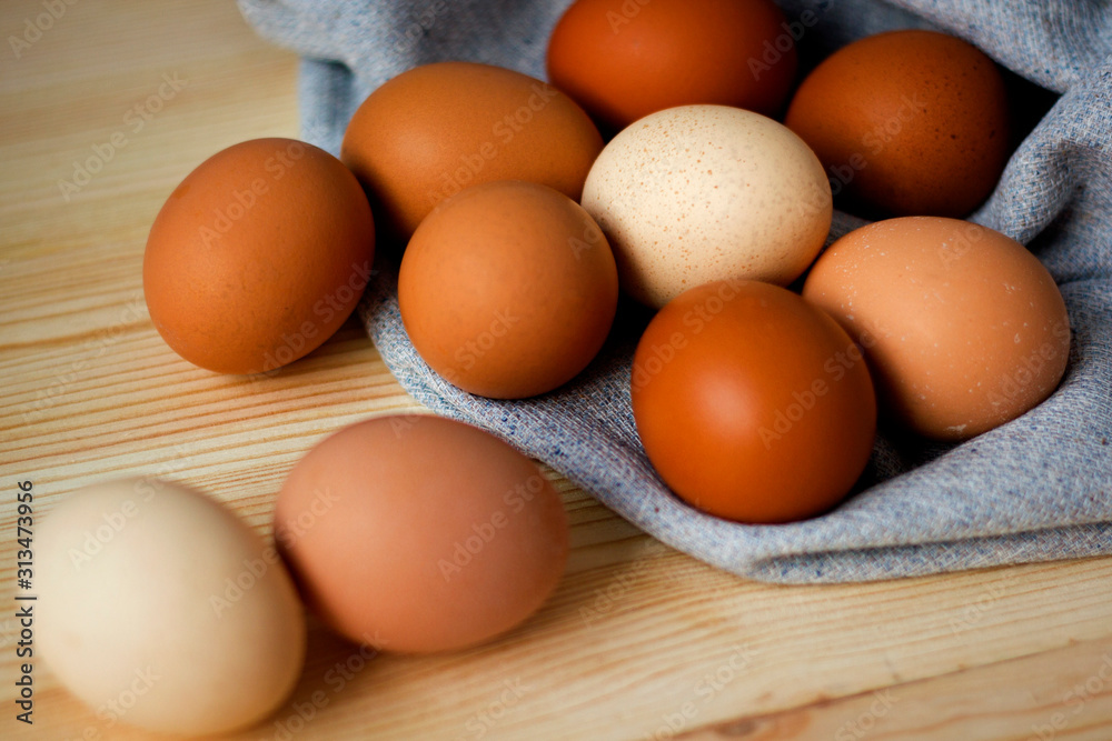 Whole and broken raw chicken eggs on a plate on a table yolk protein follows Easter eggs recipe food Whole and broken raw chicken eggs on a plate on a table yolk protein follows Easter eggs recipe food