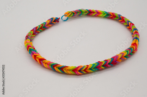 bracelets made of rubber bands and beads on a white background