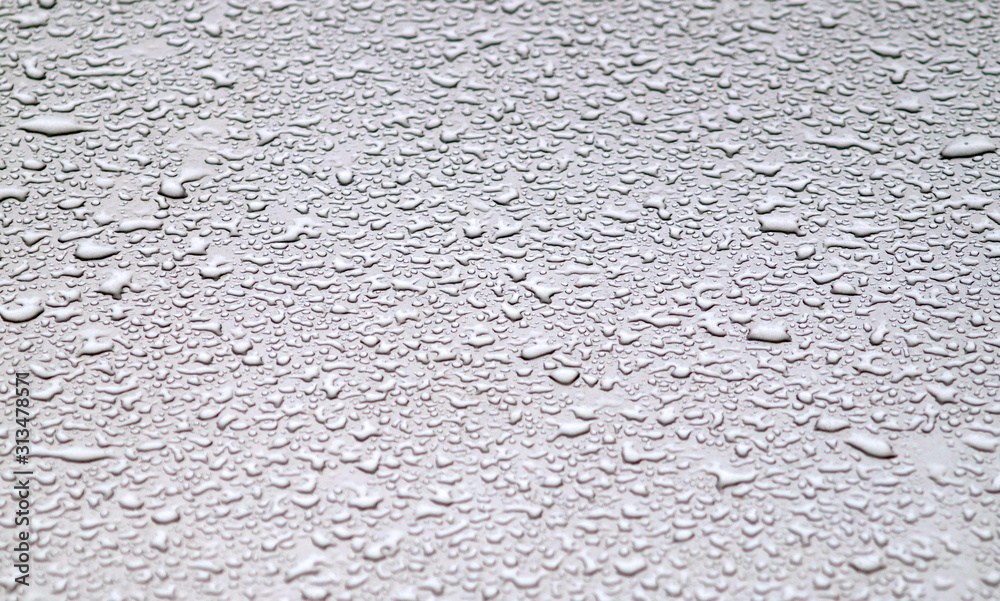 Waterdrops on grey surface.
