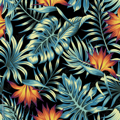 Tropical vintage floral palm leaves orange strilitzia flower seamless pattern black background. Exotic jungle wallpaper.  