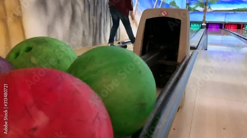 bowling ball rolls out for other players