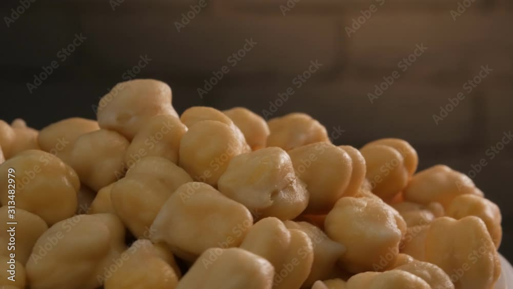Closeup of rotating chickpeas. A bunch of bean grains. Closeup of rotating chickpeas. A bunch of bean grains.